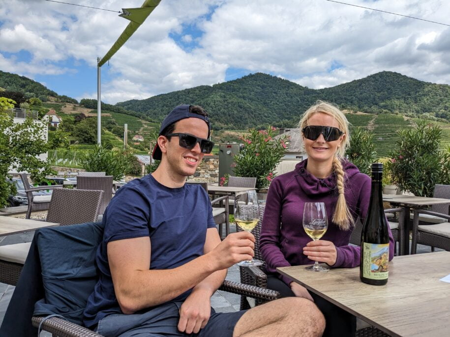 young couple drinking wine in the wachau valley