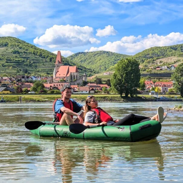 a couple kayaking on the danube river through the wachau valley with venture vienna